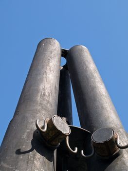 thre old cannons aganst the blue sky