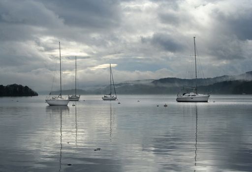 sailing boats on Lake Windermere in English Lake District.
