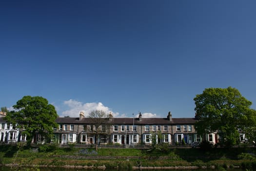 row of  houses under clear sky
