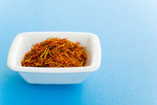 Vase of Saffron over a blue background