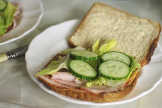 wholemeal ham and salad sandwich with cucumber lettuce 