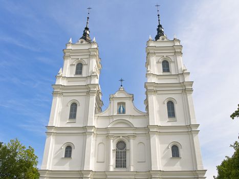 white Church against the blue cloudy sky 