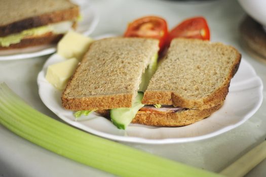 wholemeal salad sandwich with cucumber lettuce and tomatoes