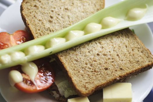  wholemeal salad sandwich with cucumber lettuce and tomatoes plus celery