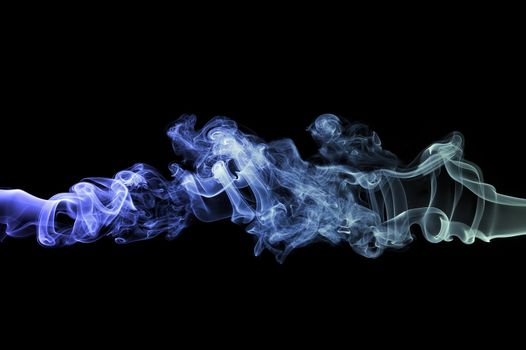 Abstract colored (blue/cyan) smoke on black background
