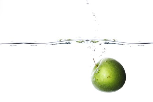 Apple dropped to water on white background