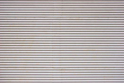 Weathered painted corrugated metal sheet texture background