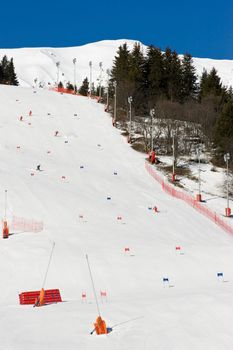 Group of alpine skiers racing on piste at Meribel Valley, France