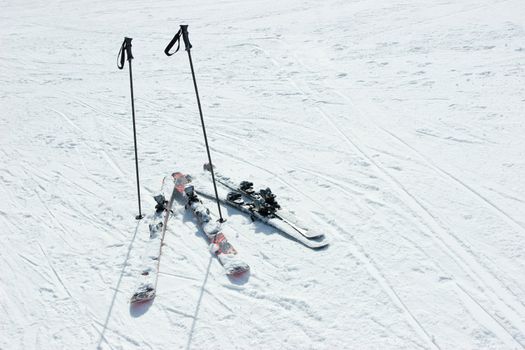Skis and poles on a slpoe at ski resort