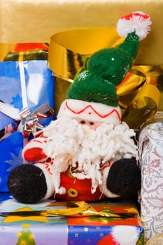 Santa puppet and decorated gift boxes with ribbons