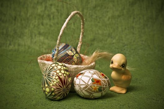 easter composition with eggs and a duckling

