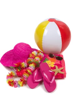 Colorful summer beachwear, flipflops, hat, orchids, sunglasses, beach ball and starfish