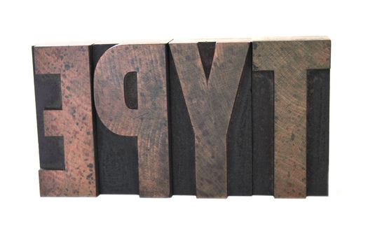 the word 'type' in old wood type isolated on white 