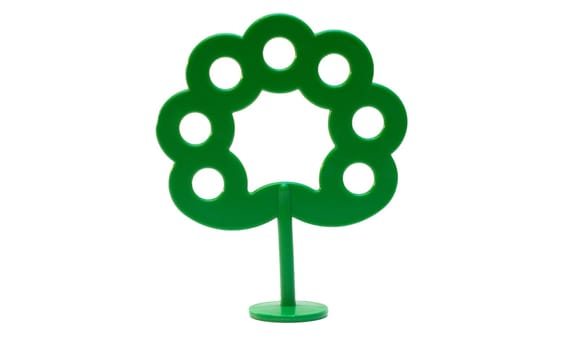 Children's toy bright plastic green tree on a support