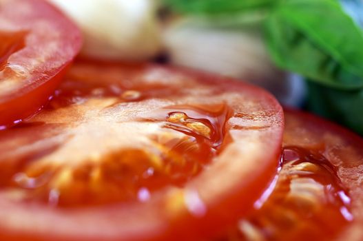 Sliced tomatoes with garlic and basil