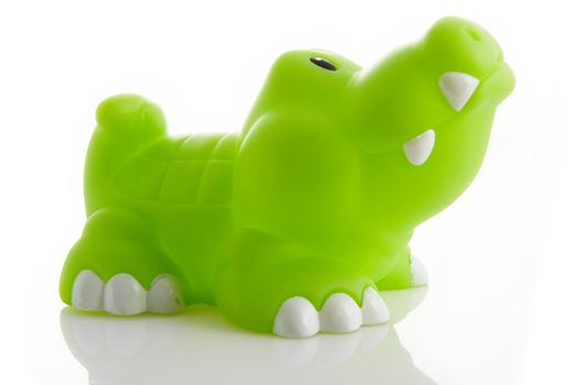 children's toy alligator on isolated white background