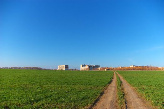 photo of the road through green field