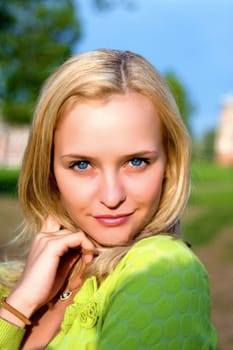 Portrait of the beautiful girl in beams of the coming sun