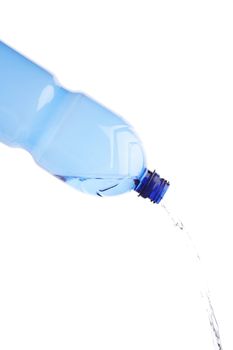 Pouring water from blue plastic water bottle