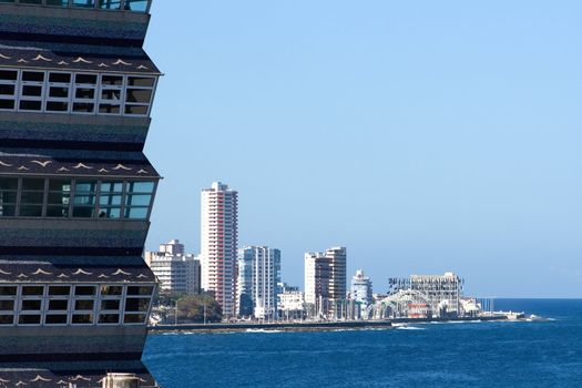 Coastline with skyscrapers and close-up view of a building`s corner. Havana, Cuba.