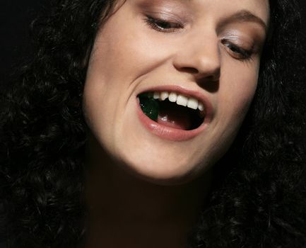 portrait of girl with jelly pastille in lips. 