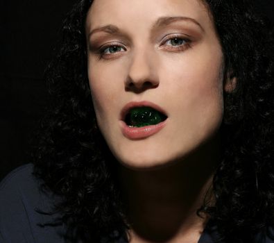 portrait of girl with jelly pastille in lips. 