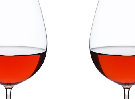 Isolated close up of red wine glass over a white background