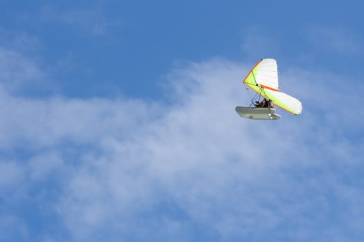 Hang-glider in a blue sky with two men onboard. Cayo Coco, Cuba.