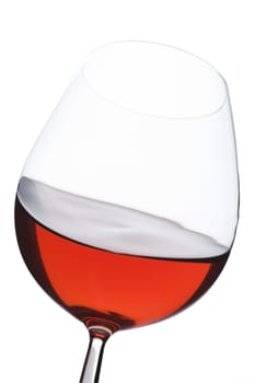 Isolated close up of red wine glass over a white background