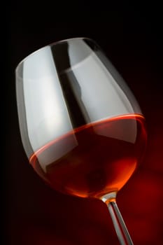 red wine glass over a dark background