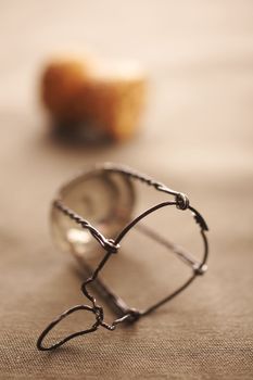 Champagne bottle cork and metal holder on the table