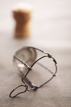 Champagne bottle cork and metal holder on the table