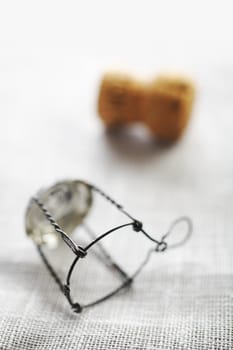 Champagne bottle cork and metal holder on the table