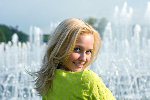 Portrait of the girl having a rest in the summer in park