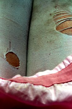 ripped, dirty pantyhose and pink skirt.