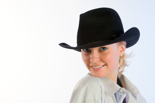 Portrait of young beautiful woman in a hat 
