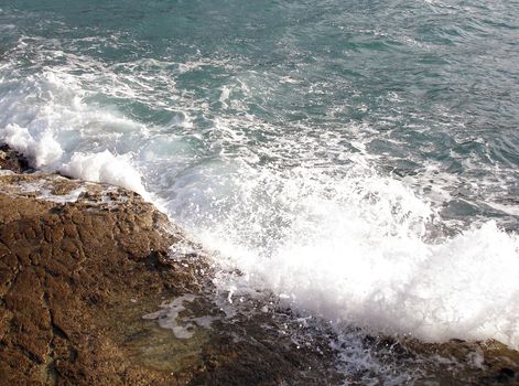 A wave breaking on the shore