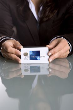 businesswoman holding credit card