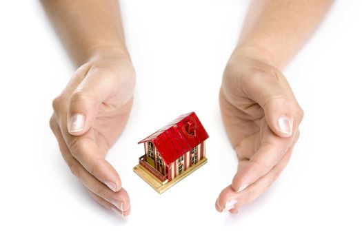 woman hands with small house - real state concept