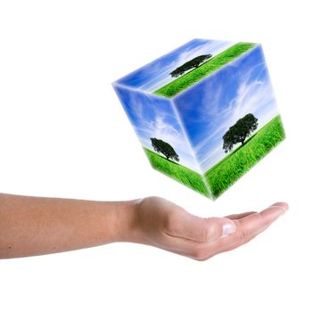 woman hand holding landscape cube in 3d - earth nature and environment concept