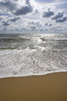 beach seascape with puffy clouds