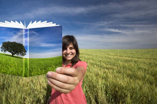 young woman smiling holding book with colorful cover