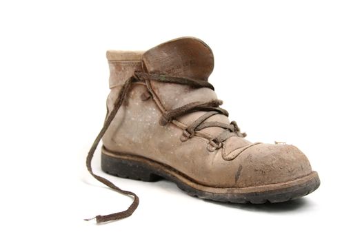 Dirty old brown pigskin leather work boot, very worn, with metal reinforcements to the sole