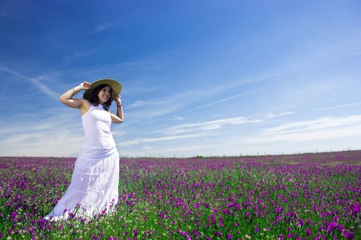 beautiful young woman white white dress and had in the nature