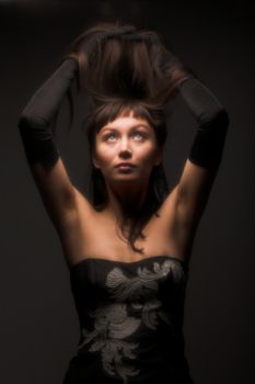 young black hair woman portrait on dark background

