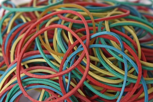 It is a heap of elastic bands for money. They are necessary at office and in accounts department. They multi-colored, bright.