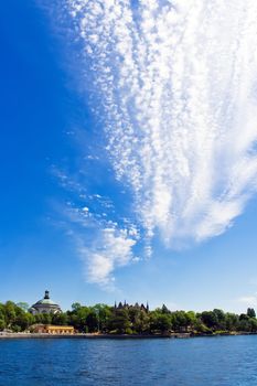 Cityskape on magnificent cloudy blue sky