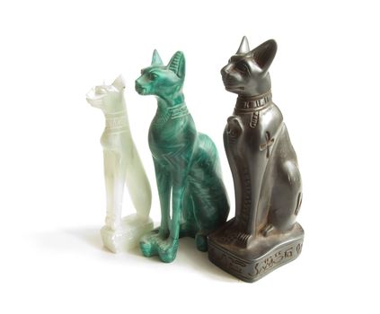 Stone Egyptian cats on a white background 