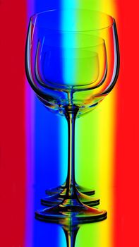 Three  Elegant Tall Wineglass For  Wine  Over Motley  Background.