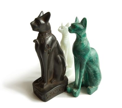 Stone Egyptian cats on a white background 